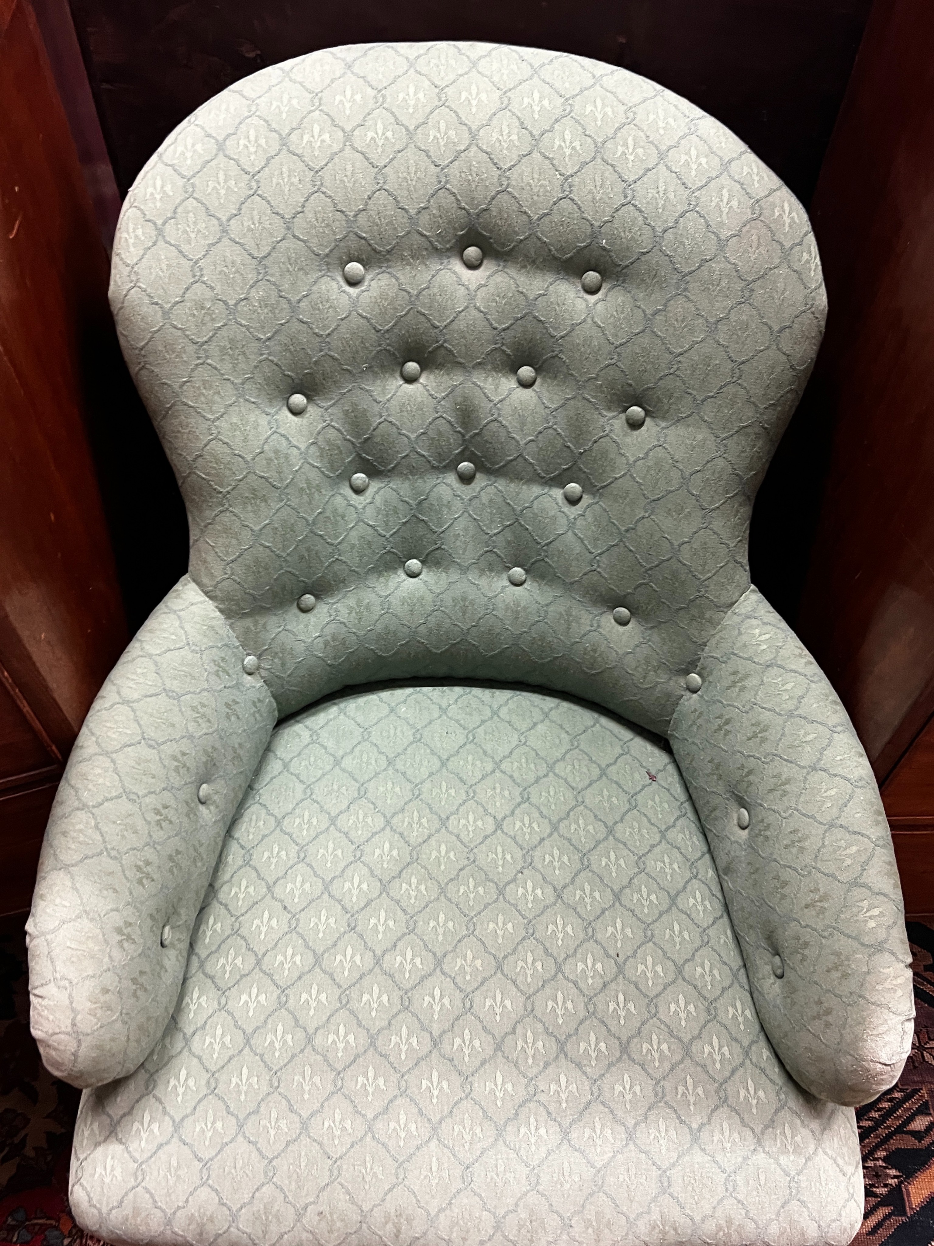 A Victorian upholstered spoon back armchair, width 66cm, depth 84cm, height 79cm